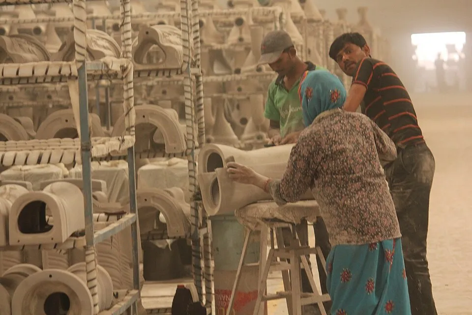 Workers sorting freshly arrived toilets from the furnace.jpg