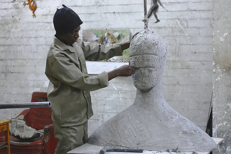 Sculptor and his work (Unsplash).jpg