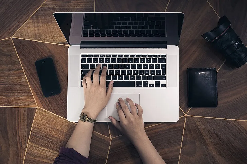 Hands on a laptop keyboard (Unsplash).jpg