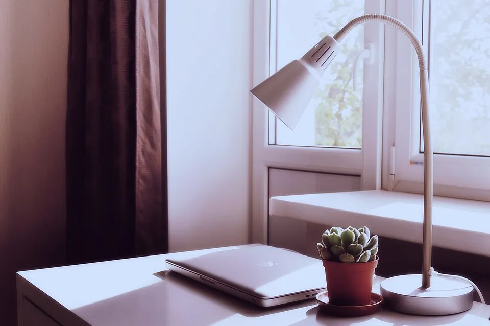 Laptop and lamp on table (Unsplash).jpg