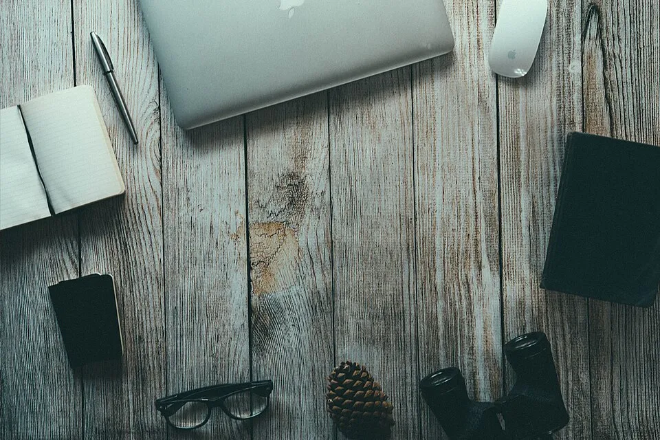 Typewriter, pinecone, book, and glass (Unsplash).jpg